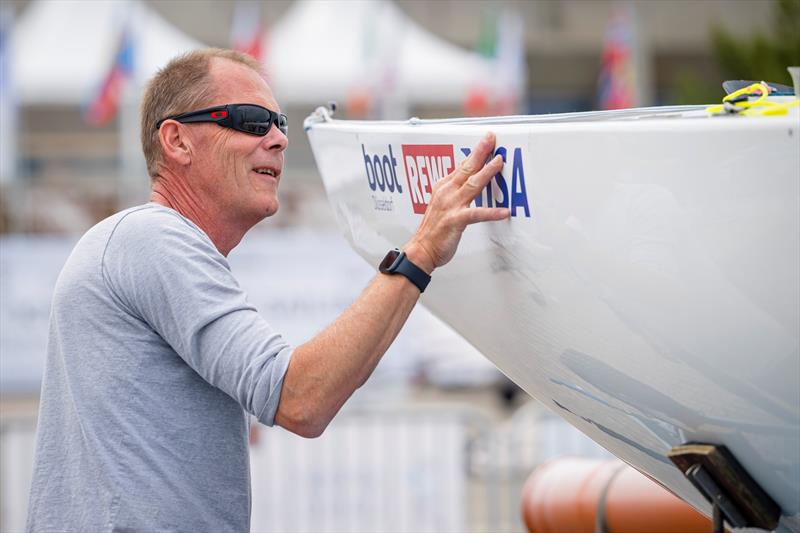 Boat care in the 2.4mR also means sponsor care, as world champion Heiko Kröger knows at the Kiel Week World Championship dress rehearsal photo copyright Sascha Klahn taken at Kieler Yacht Club and featuring the 2.4m class