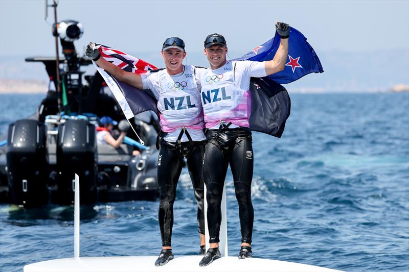 Isaac McHardie William McKenzie (NZL) celebrate winning silver in the Men's Skiff - Paris Olympic Sailing in Marseille, France August 2, 2024 photo copyright World Sailing / Sander van der Borch taken at  and featuring the 49er class