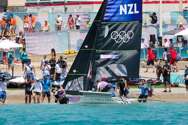 Silver medalists - Isaac McHardie and Will McKenzie (NZL) arrive on tghe beach - Mens Skiff - Paris2024 Olympic Sailing Event - Marseille - August 2, 2024 photo copyright World Sailing / Lloyd Images taken at Royal Akarana Yacht Club and featuring the 49er class