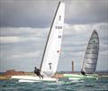 Sisters.  Hugh MacGregor GBR 18 on his A-Cat Tool design, and Grant Piggott GBR 1073 on his Unicorn during the Unicorn and A Class Catamaran Nationals at Hayling Ferry SC © Gordon Upton / www.guppypix.com