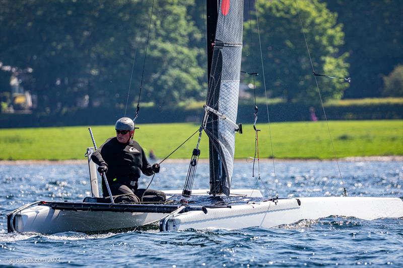 Hugh MacGregor checks his competition during the Rutland Cat Open 2024 - photo © Gordon Upton / www.guppypix.com