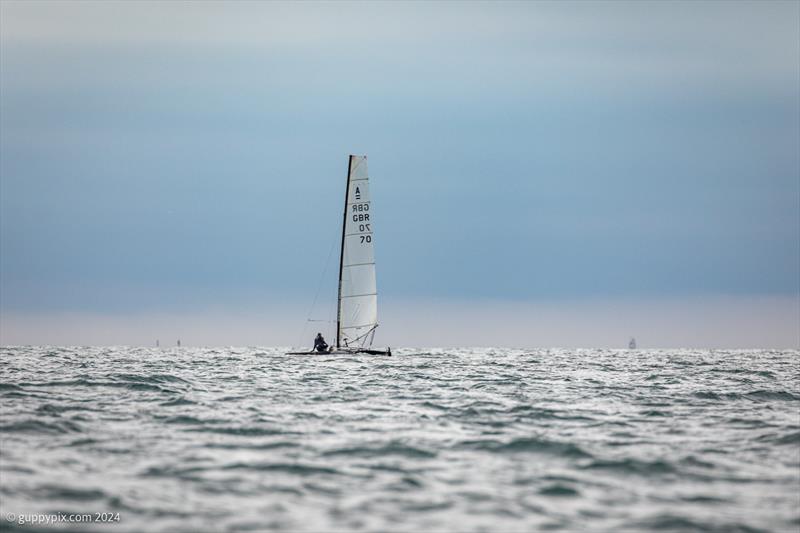 Ben Daignault just sailing away into the distance during the Unicorn and A Class Catamaran Nationals at Hayling Ferry SC photo copyright Gordon Upton / www.guppypix.com taken at Hayling Ferry Sailing Club and featuring the A Class Catamaran class