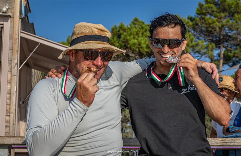 A Class Cat Regata Nazionale - Open winner Misha Heemskerk NED, and runner up Ravi Parent, USA in classic Olympic pose photo copyright Gordon Upton / www.guppypix.com taken at Centro Velico Punta Ala and featuring the A Class Catamaran class