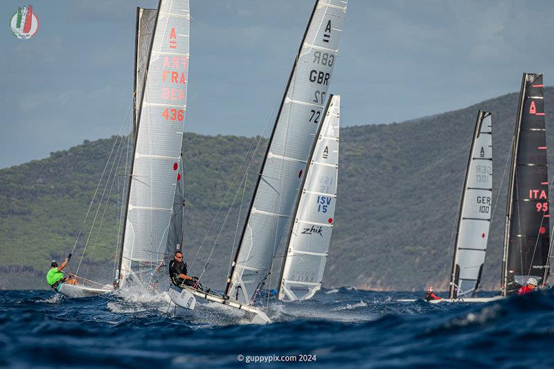 GBR sailor Owen Cox having the time of his life, in the bath-like sea temperatures - A Class Cat Worlds at Punta Ala day 1 - photo © Gordon Upton / www.guppypix.com