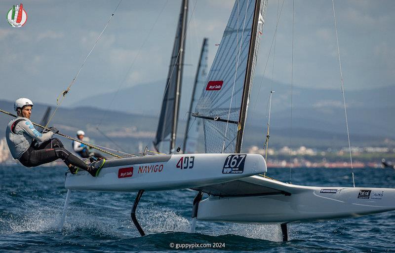 Kuba Surowiec racing hard and fast to retain his World Title - A Class Cat Worlds at Punta Ala day 2 - photo © Gordon Upton / www.guppypix.com