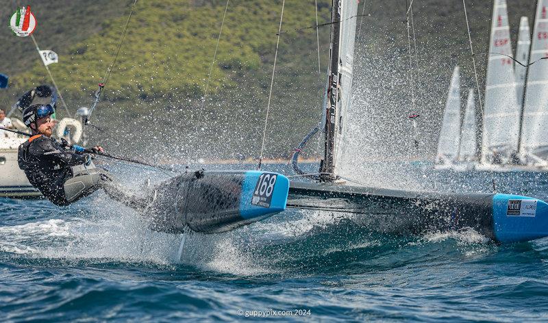 Robin Maeder is the Swiss Champ (he is heroically burning the midnight oil as the fleet repair man) - A Class Cat Worlds at Punta Ala day 2 - photo © Gordon Upton / www.guppypix.com