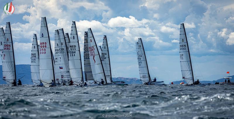 A Class Cat Worlds at Punta Ala: The start of the final Open race of the 2024 Worlds at PuntAla in challenging top end breeze.  The champion, Kuba Surowiec, is already out of shot - photo © Gordon Upton / www.guppypix.com