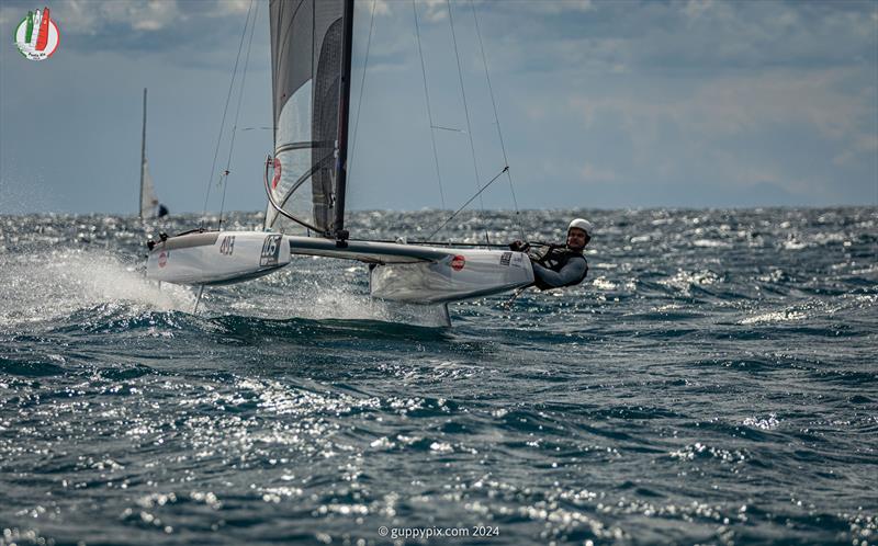 A Class Cat Worlds at Punta Ala - Darren Bundock, AUS 888, sailed a great campaign to get his Runner Up podium slot.  Bundy is another sailor totally at home in the fruity stuff - photo © Gordon Upton / www.guppypix.com