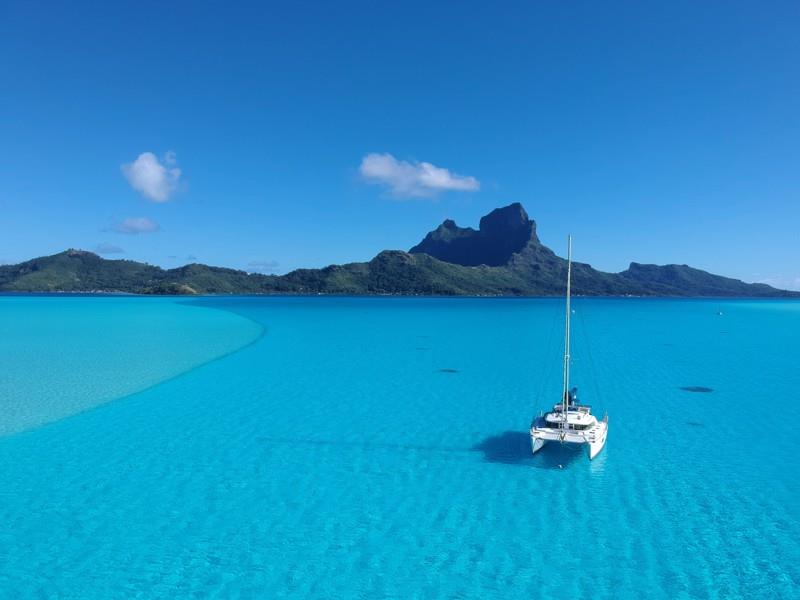 Two Drifters enjoying the tranquility of Taurere Bay in Bora Bora photo copyright Jenevora Swann taken at  and featuring the Catamaran class