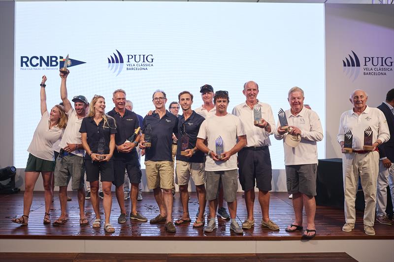 Puig Vela Clàssica Barcelona Regatta Prize Winners (l-r) Olympian (Class P), Anima II (Modern Classic), Kanavel (Classics II), Northern Light (12 m Division D), Kookaburra (12 m Division A), Comet (Bermudian Era), Viveka (Big Boat), and Oriole (Gaff Era) photo copyright Vincent Curutchet taken at Real Club Nautico de Barcelona and featuring the Classic Yachts class