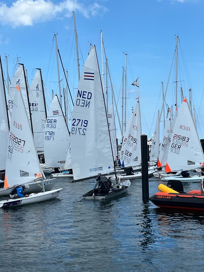 An on-water traffic jam on Saturday during Kieler Woche when five fleets are released to launch at once photo copyright Martin Pascoe taken at Kieler Yacht Club and featuring the Contender class