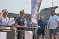 Henry Powell, Martin Wood and Iain Wilson collecting silverware - Cardigan Bay Regatta at New Quay YC &copy; Tilly Andrews