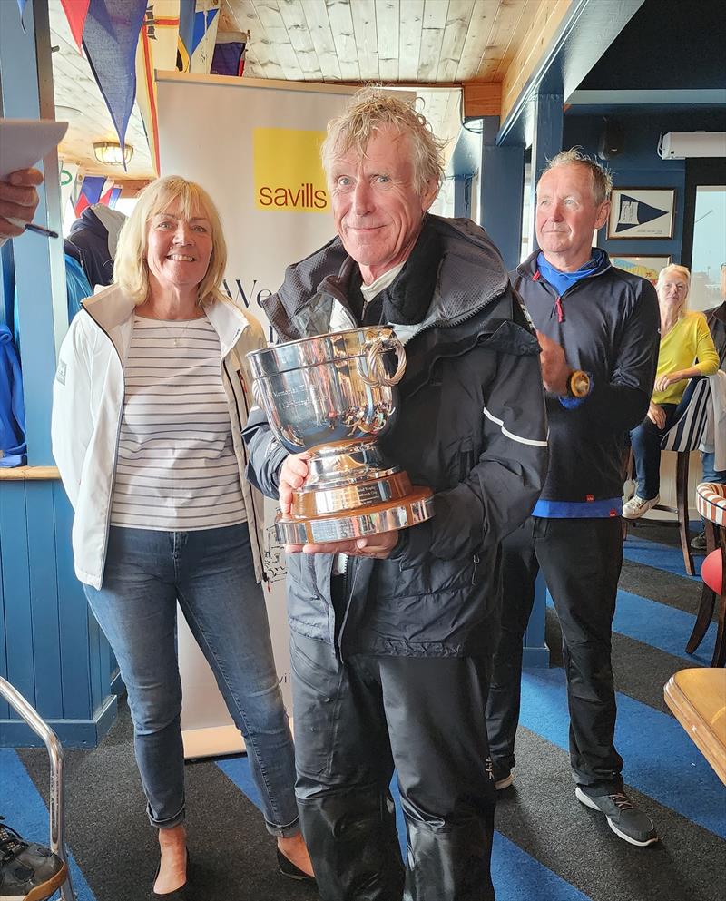 76th Edinburgh Cup 2024 Day 3: Lawrie Smith with the Terry Wade Memorial Trophy photo copyright Emma York taken at South Caernarvonshire Yacht Club and featuring the Dragon class