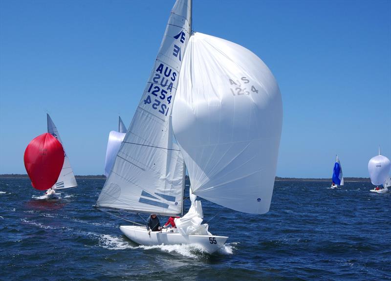 Metung fleet boat Odyssey AUS1254 ahead of Mens Shirts Short Skirts AUS1141, from Cruising Yacht Club of Australia, on the downwind leg with spinnakers flying. They were competing in the Etchells 2025 Australian championship, on Lake King at Metung photo copyright Jeanette Severs taken at Metung Yacht Club and featuring the Etchells class