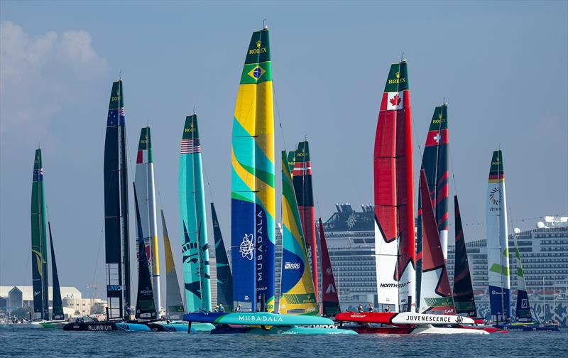 The SailGP fleet in action with Mubadala Brazil SailGP Team and Canada NorthStar SailGP Team in the foreground during racing on Race Day 1 of the Emirates Dubai Sail Grand Prix - November 23, 2024 photo copyright Simon Bruty/SailGP taken at Dubai Offshore Sailing Club and featuring the F50 class