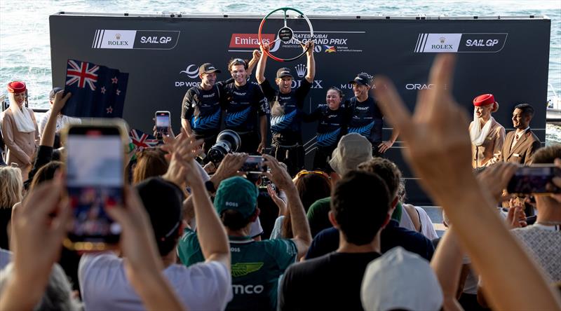 Peter Burling, co-CEO and driver of New Zealand SailGP Team, celebrates victory on the podium with the New Zealand SailGP Team on Race Day 2 of the Emirates Dubai Sail Grand Prix photo copyright Christopher Pike/SailGP taken at Dubai Offshore Sailing Club and featuring the F50 class