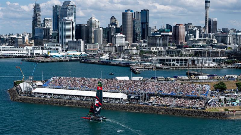 Switzerland SailGP Team helmed by Sebastien Schneiter sails past the spectators watching from the grandstands on Race Day 1 of The Rolex SailGP Championship ITM New Zealand Sail Grand Prix in Auckland, New Zealand - photo © Bob Martin for SailGP