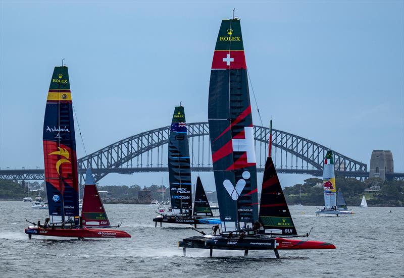 Switzerland SailGP Team helmed by Sebastien Schneiter with New Zealand SailGP Team, Spain SailGP Team and Red Bull Italy SailGP Team during racing in front of Sydney Harbour Bridge on Race Day 1 of the KPMG Australia Sail Grand Prix photo copyright Jason Ludlow for SailGP taken at  and featuring the F50 class