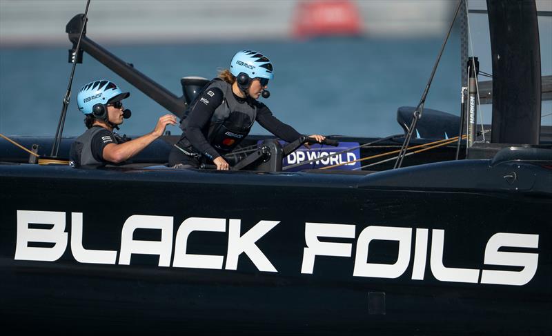 Black Foils' Strategist Liv Mackay  back on the grinders during Practice Racing on Friday - SailGP Grand Final - Abu Dhabi - November 28, 2025  photo copyright Ricardo Pinto/SailGP taken at Abu Dhabi Marine Sports Club and featuring the F50 class