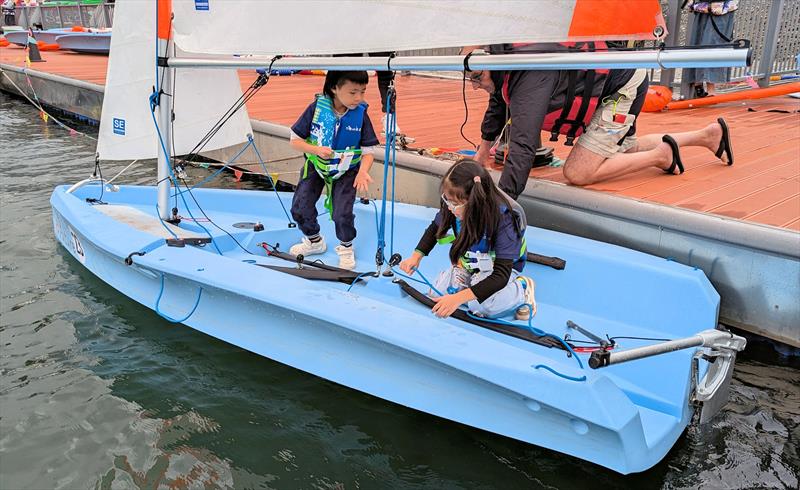 Bruce Hobday helping kids launch during the Shuifu Jinshajiang River Regatta  - photo © Mark Jardine