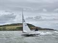 Club Commodore Scott McColm on the crest of a wave at some speed in his Finn during Kippford Week © Richard Bishop