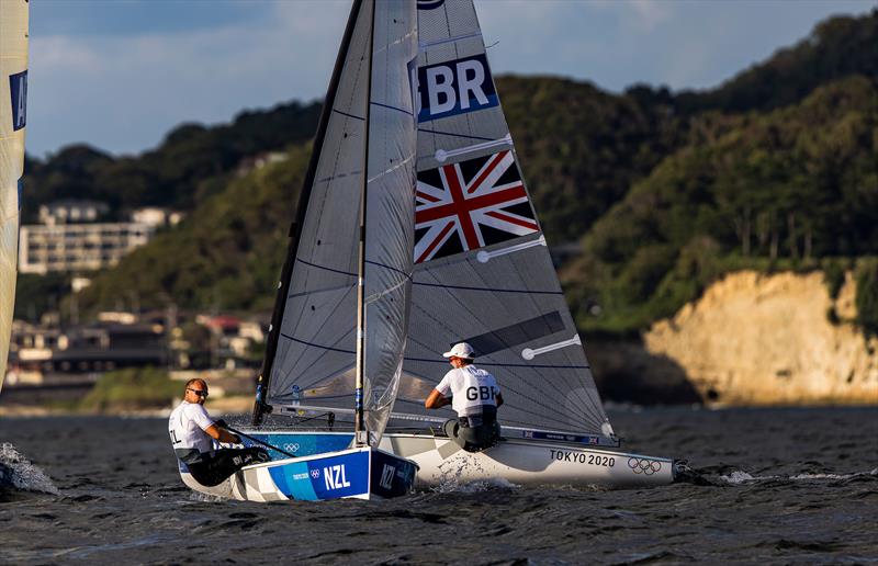 Josh Junior (NZL) crossed Giles Scott (GBR) on Tokyo 2020 Olympic Sailing Competition Day 3 photo copyright Sailing Energy / World Sailing taken at  and featuring the Finn class