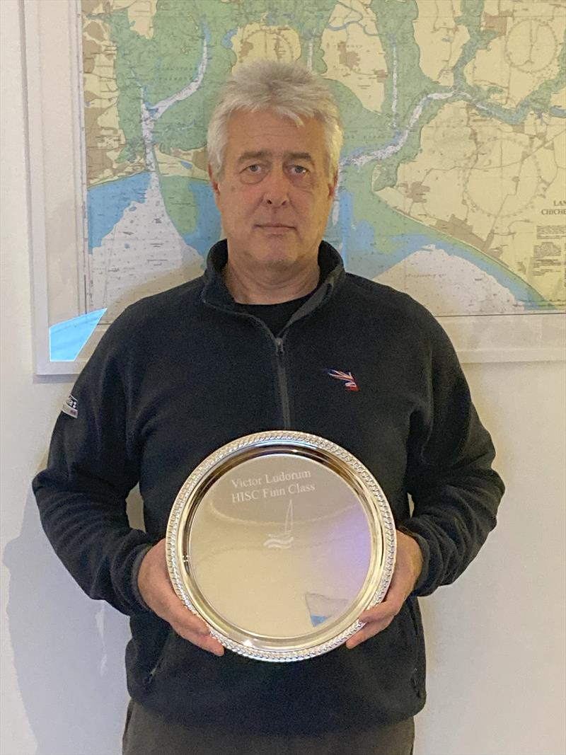 Simon Pettit with the Victor Ludorum plate photo copyright Maria Pettit taken at Hayling Island Sailing Club and featuring the Finn class