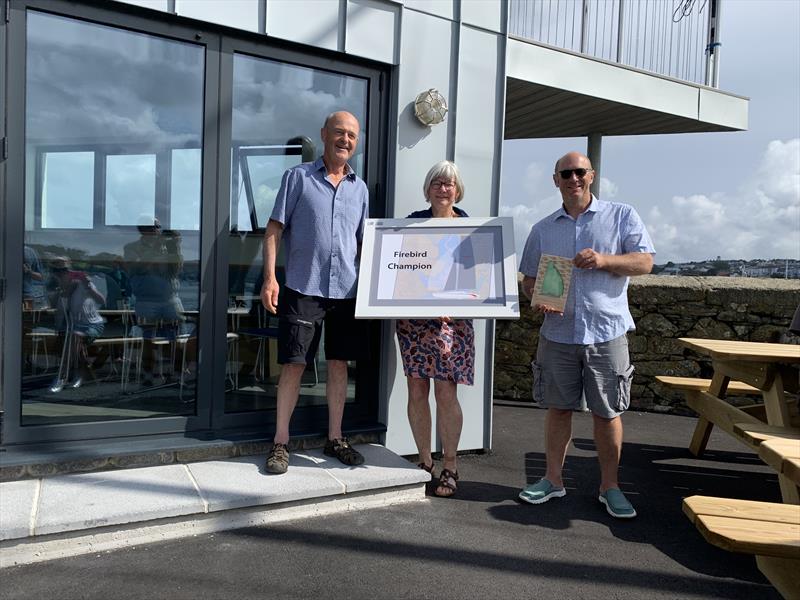 Ultraviolet's Peter Stephens and Tom Laity (together with Gaye Slater, Flushing SC Commodore) retain their trophy from 2019 in the 2021 Firebird Championship at Flushing Sailing Club photo copyright www.kitesurfkit.com taken at Flushing Sailing Club and featuring the Firebird class