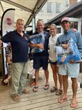 Firefly Nationals 2025 at Lyme Regis - Becky Caiger and Rory Gifford with Alex and Stella Davey are the overall Buddies winners © Jo Mason
