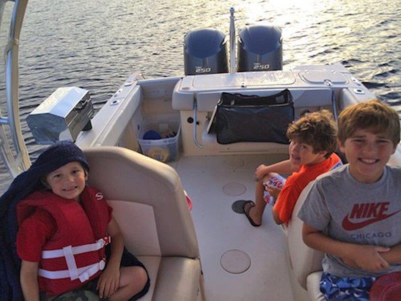 St. Denis family spending time together on their Grady-White Freedom 275 photo copyright Grady-White taken at  and featuring the Fishing boat class