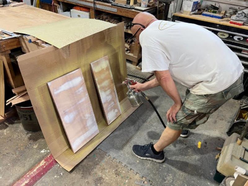 Hull #7 - Mario veneering refrigerator doors - photo © Michael Rybovich & Sons
