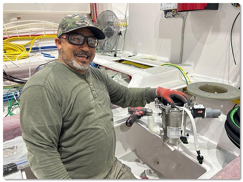 Mechanic Jose Garcia is responsible for installing several systems in the engineroom - photo © Viking Yachts