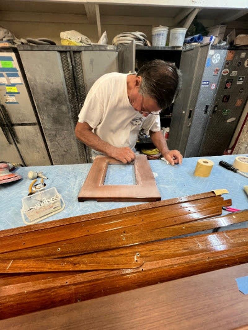 Hull #7 - Keith prepping clear coat - photo © Michael Rybovich & Sons