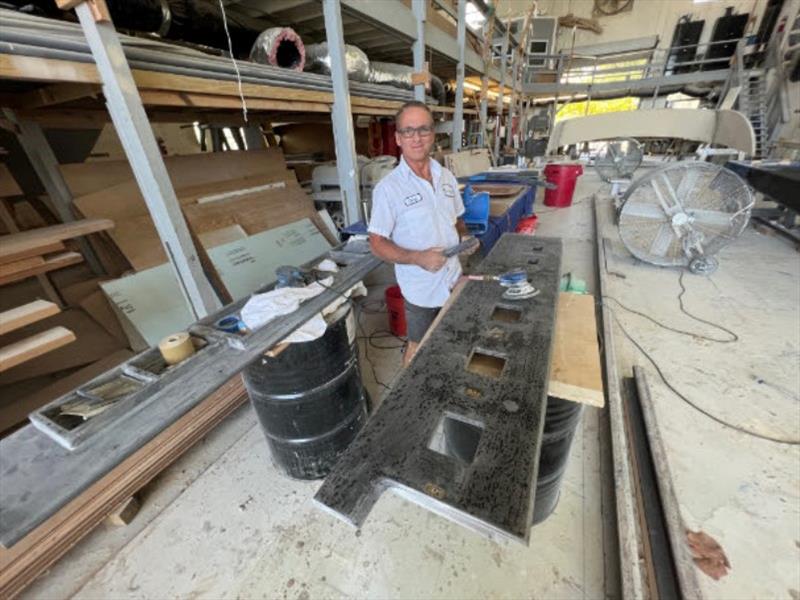 Hull #10 - Chris priming battery trays - photo © Michael Rybovich & Sons