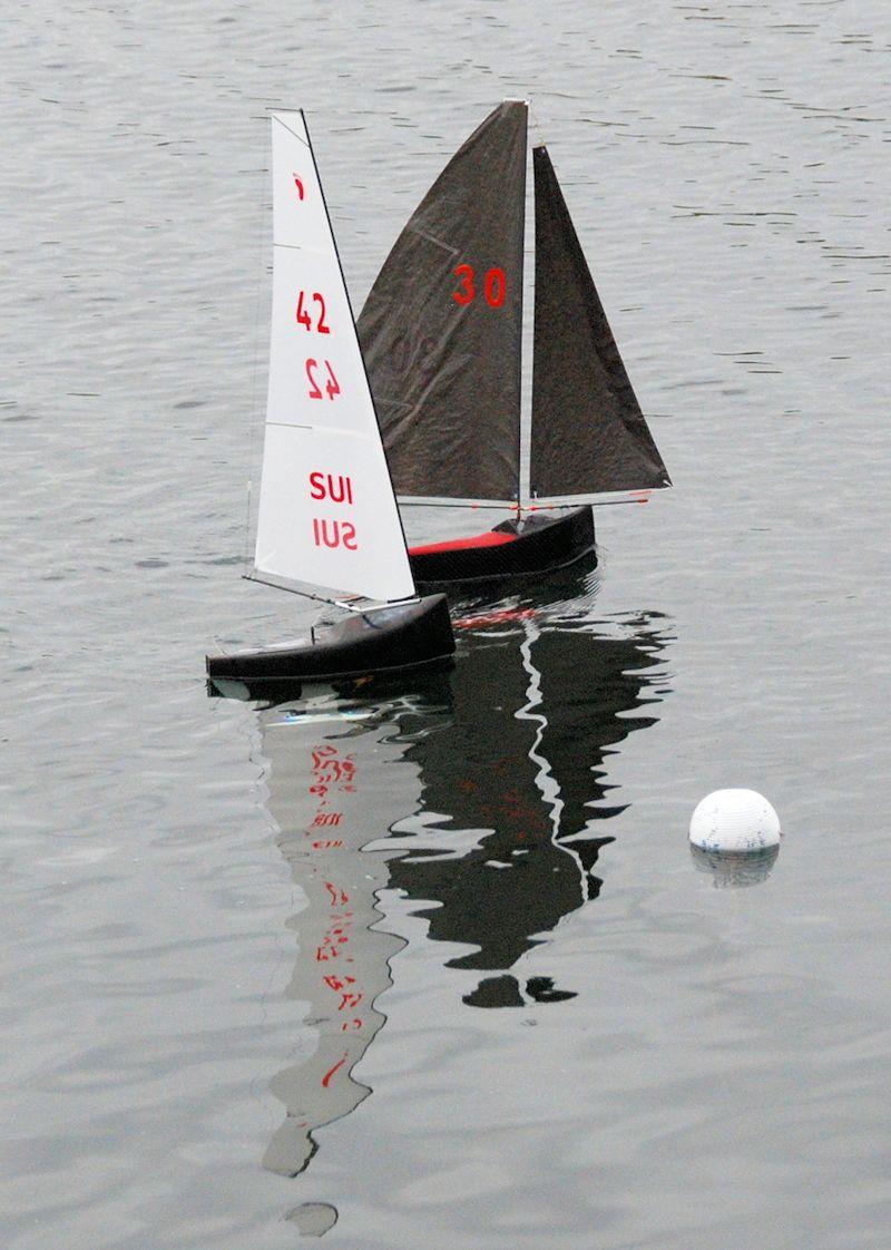 Peter Jackson 30 in a close finish with David Wilkinson 42 in race 15 - Fred's Big Toephy Footy for Footy class photo copyright Keith Parrott taken at Guildford Model Yacht Club and featuring the Footy class