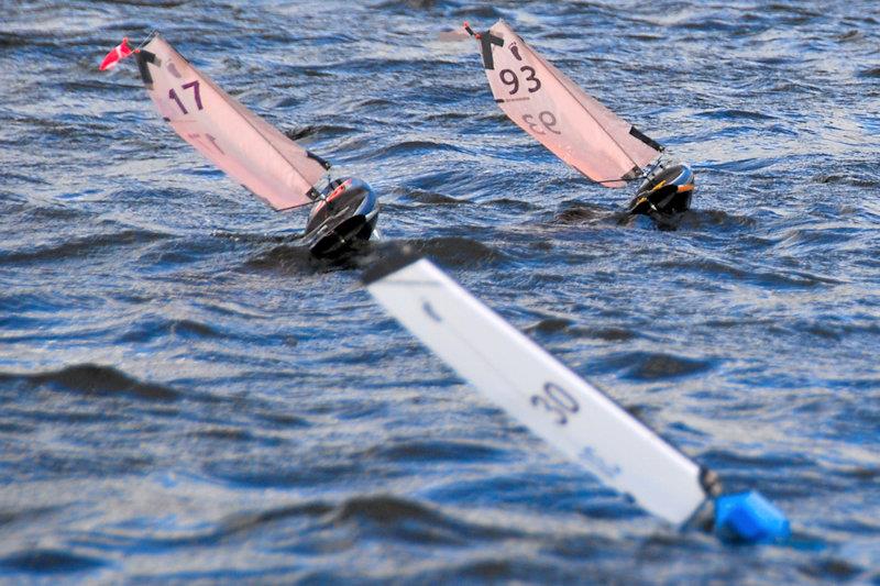 The 3 podium finishers, at the front of the fleet making good progress into the waves - Footy National Championship at Frensham photo copyright Roger Stollery taken at Frensham Pond Sailing Club and featuring the Footy class