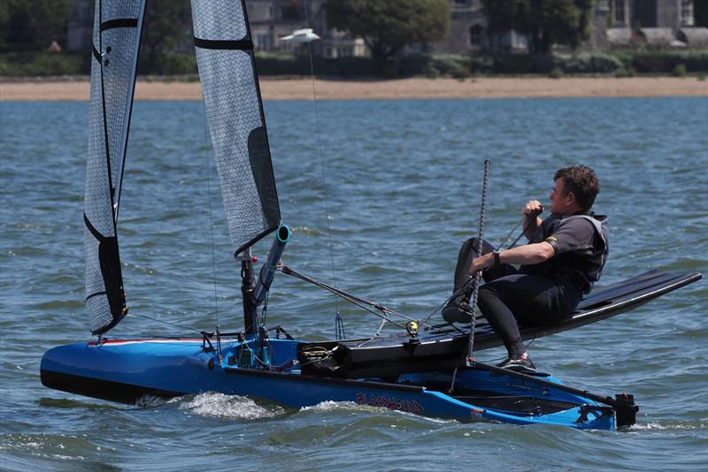 Clive Everest looking very smooth and quick, before testing the water cleanliness - International Canoe May Cup Invitational at Weston photo copyright Dougal Henshall taken at Weston Sailing Club and featuring the International Canoe class