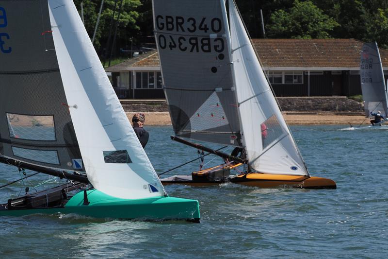 While Tim Garvin in 308 went further inshore than anyone to avoid the flooding tide, event winner Chris Hampe in 340 was powering his way to the front - International Canoe May Cup Invitational at Weston - photo © Dougal Henshall