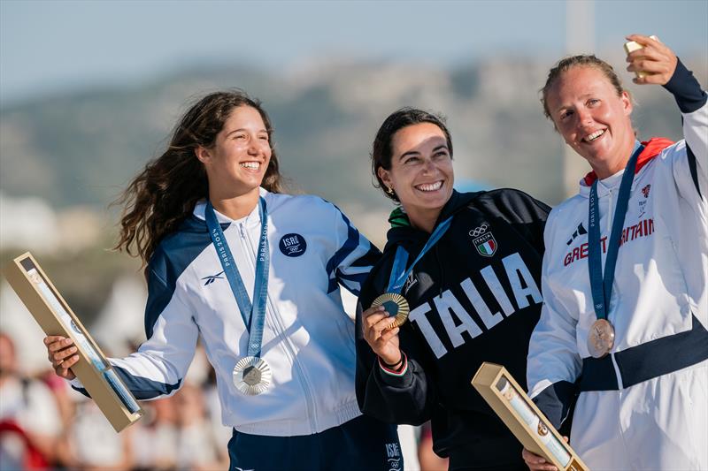 Women's iQFoil medallists (l-r) Sharon Kantor, Marta Maggetti & Emma Wilson pose for a selfie in Marseille at the Paris 2024 Olympic Regatta - photo © World Sailing / Jean-Louis Carli