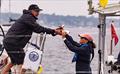 Prosecco hand-off at the finish - Ida Lewis Distance Race 2024 © Stephen R Cloutier