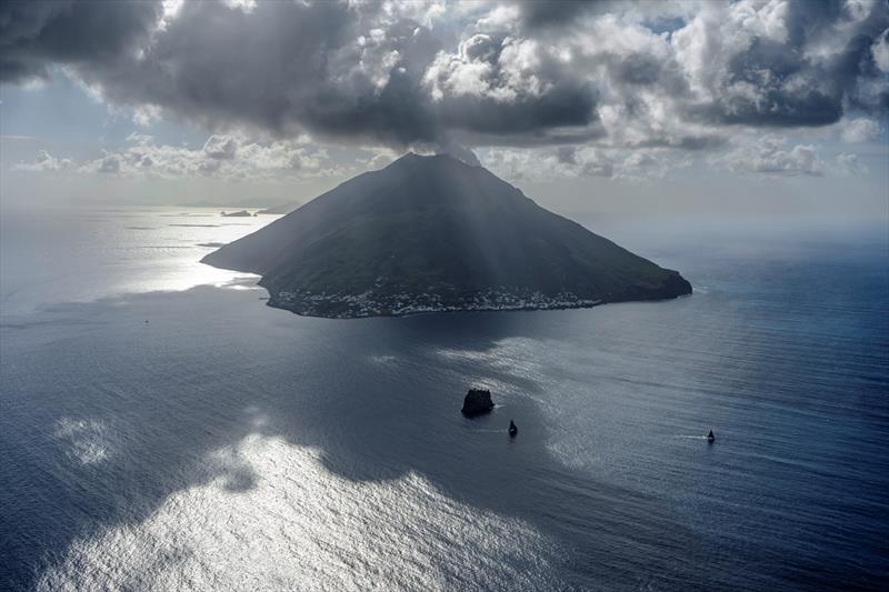 Rolex Middle Sea Race - Boats passing the Stromboli photo copyright Kurt Arrigo / Rolex taken at Royal Malta Yacht Club and featuring the IRC class