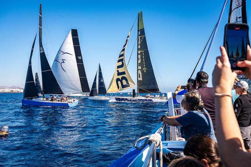 Spectators enjoy the start off Marina Lanzarote - RORC Transatlantic Race photo copyright Lanzarote Sport taken at Royal Ocean Racing Club and featuring the IRC class