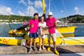 Renan Le Penven and Thierry Roger of Perros-Guirec (FRA) receive a warm welcome and GTA goodie bag from Zara Tremlett, Camper & Nicholsons Port Louis Marina © Arthur Daniel / RORC