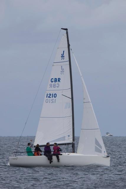 Sam Hall and crew on Mojito Bach, joining in the fancy dress at the Pwllheli Regatta by all wearing women's floral print dresses photo copyright Paul Jenkinson taken at Pwllheli Sailing Club and featuring the J70 class