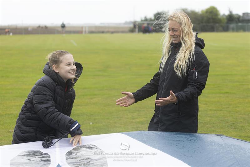 2023 Formula Kite Europeans - Ellie Aldridge (right) talks through winging with the kids photo copyright IKA media / Mark Lloyd taken at  and featuring the Kiteboarding class