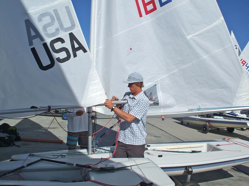 Richard Didham rigging the ILCA back in the day - photo © Richard Didham