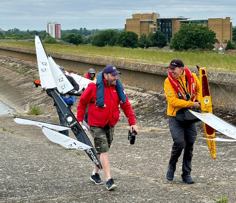 Marblehead Nationals at Datchet: Chris Harris and Rohan Williams enjoy some banter after a race photo copyright Tracey Fung taken at Datchet Water Radio Sailing Club and featuring the Marblehead class