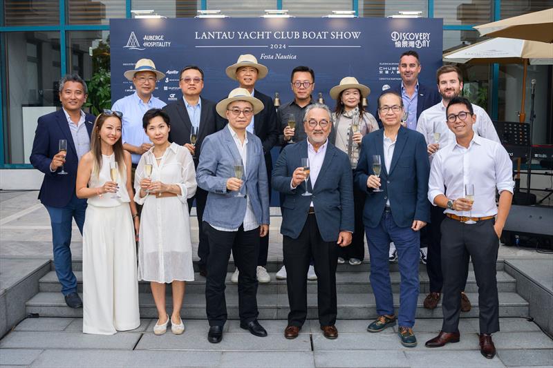 Mr Victor Cha, Chairman of HKR International Limited (third right, front row), Mr David Lee, Director, Hong Kong Property of CITIC Pacific Limited (third left, front row), Mr Jackie Tang, MD of HKR International Limited (second right, front row) & guests photo copyright Lantau Yacht Club taken at Lantau Yacht Club and featuring the Marine Industry class