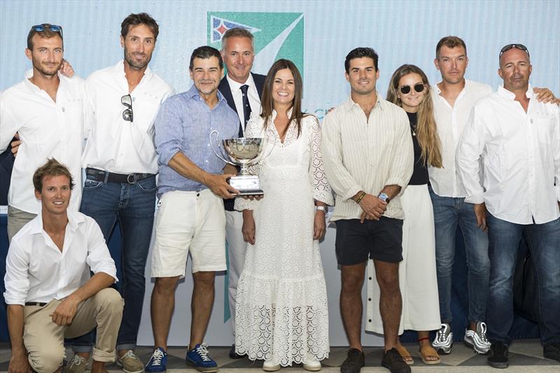 IMA Mediterranean Maxi Offshore Challenge winner in 2018-19 was Vera, owned by Argentina's Miguel Galuccio, seen here with his crew & family after being presented with silver trophy by IMA President Benoît de Froidmont at Maxi Yacht Rolex Cup prizegiving photo copyright Studio Borlenghi / International Maxi Association taken at  and featuring the Maxi class