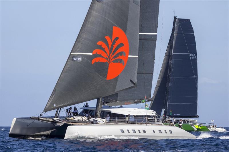 Adrian Keller's 82ft catamaran Allegra with today's Multihull class winner, the Gunboat 66 Gaetana of Riccardo Pavoncelli - 2024 Maxi Yacht Rolex Cup and IMA Maxi 1 Worlds day 3 photo copyright IMA / Studio Borlenghi taken at Yacht Club Costa Smeralda and featuring the Maxi class